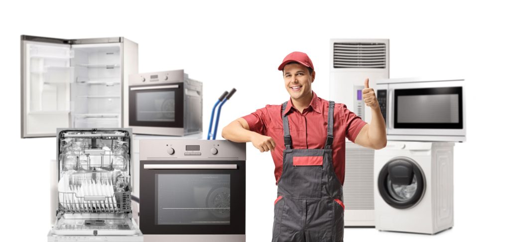 A smiling repairman in a red cap and overalls gives a thumbs up while standing next to various home appliances, showcasing reliable Appliance Repair in Oakland CA, all set against a clean white background.